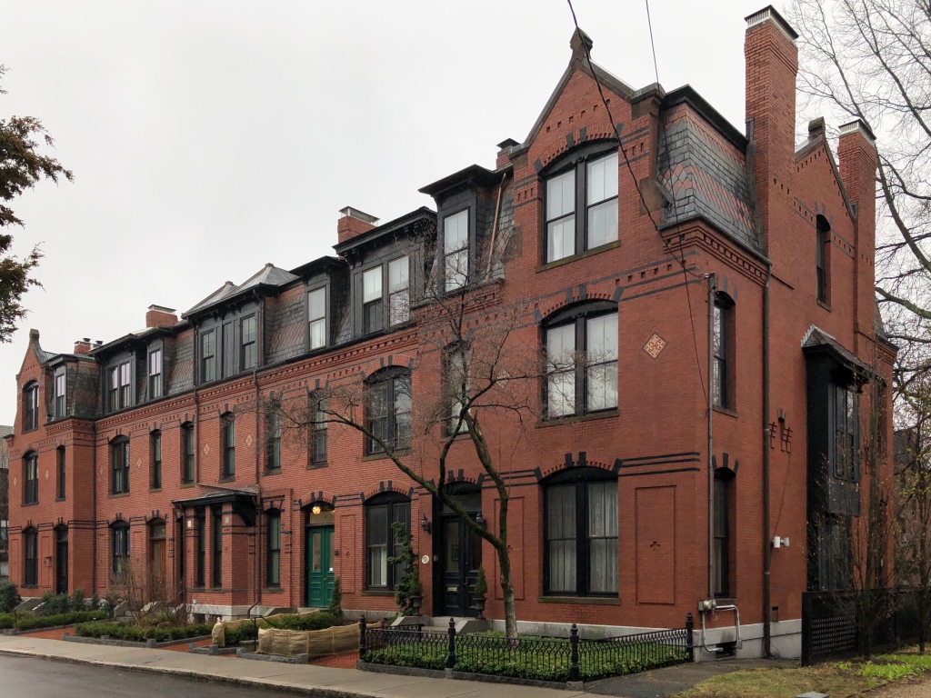 Monmouth Street in Precinct 1 with historic homes and tree cover.